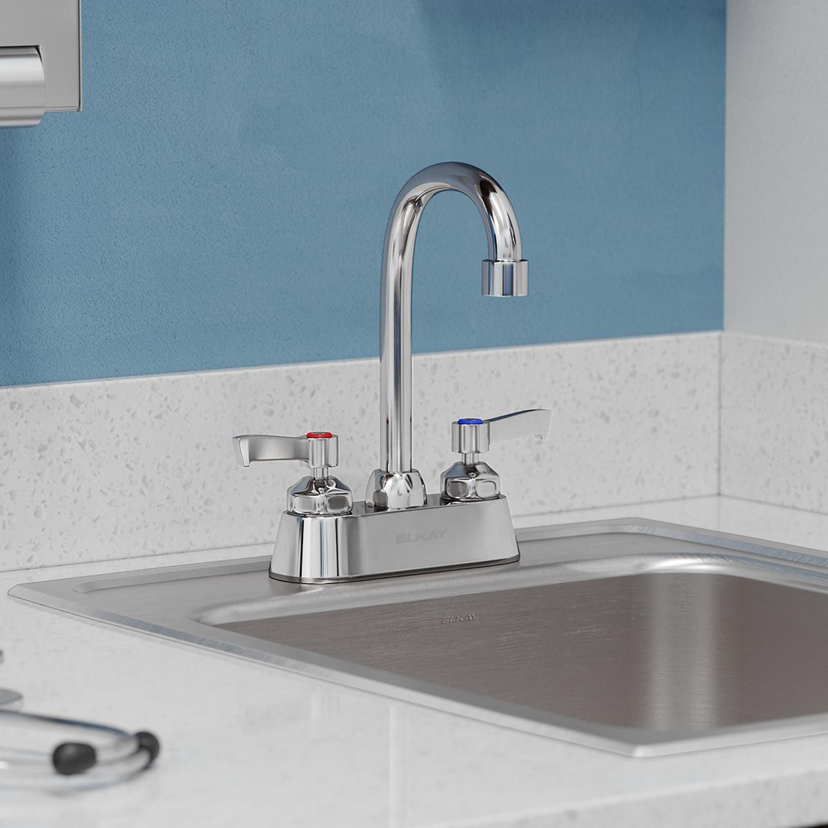 Chrome centerset faucet with gooseneck spout and two lever handles mounted on sink deck.