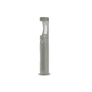 Gray pedestal-mounted outdoor water bottle filling station with spout and foot pedal.