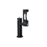 Black pedestal water fountain with two filling spouts at different heights for bottle refilling.