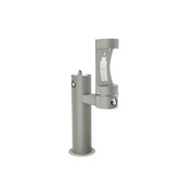 Gray pedestal-mounted outdoor water filling station with two spouts at different heights and foot pedal controls.