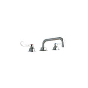 Chrome centerset faucet with tall tube spout and wristblade handles on each side.