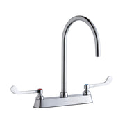 Chrome centerset faucet with tall gooseneck spout and white wristblade handles on deck plate.