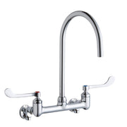 Chrome deck-mount faucet with tall gooseneck spout and two white wristblade handles.