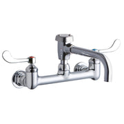 Chrome wall-mount faucet with dual wristblade handles, curved spout, and circular mounting base.