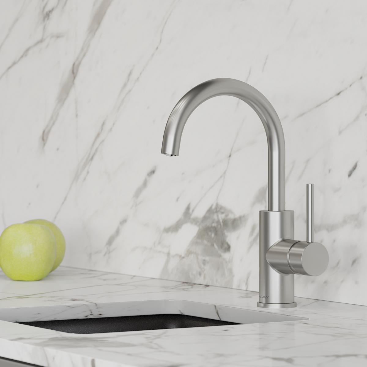 Lustrous steel single-hole bar faucet with curved spout and lever handle on marble countertop.