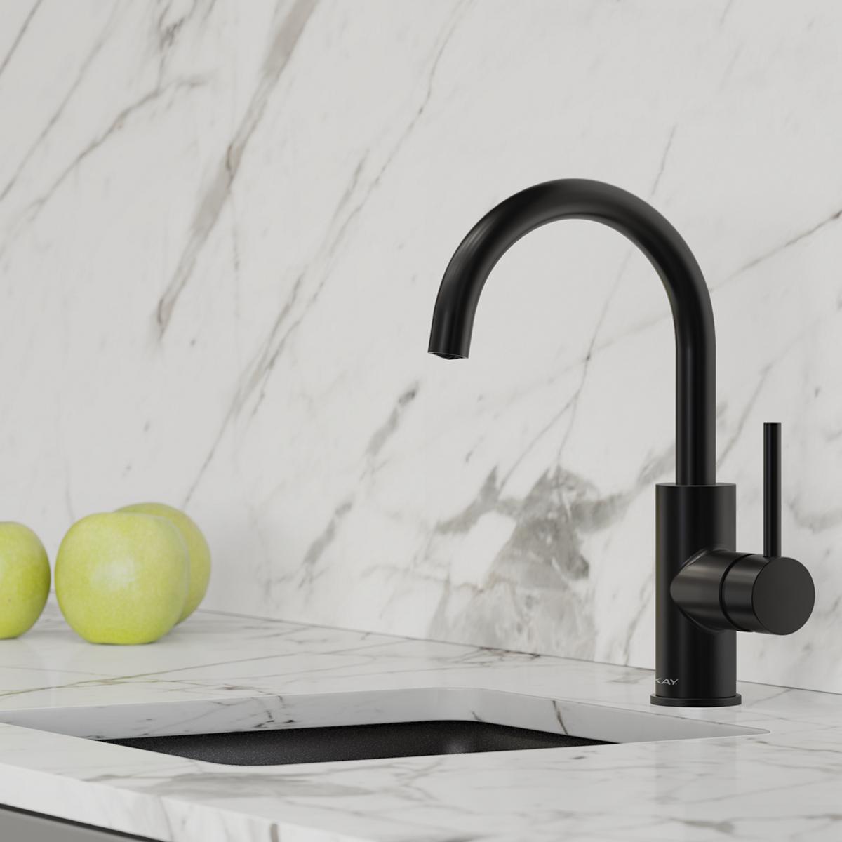 Matte black single-hole bar faucet with curved spout and lever handle on marble countertop.