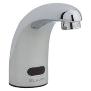 Chrome and white electronic deck mount lavatory faucet with curved spout and sensor activation.
