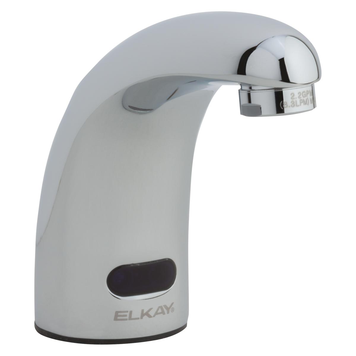 Chrome and white electronic deck mount lavatory faucet with curved spout and sensor activation.