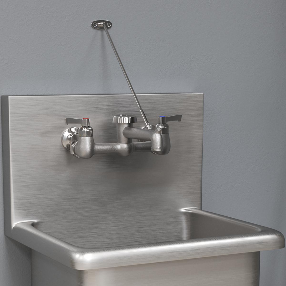 Stainless steel wall-mount faucet with dual handles, curved spout, and bucket hook mounted above a utility sink.