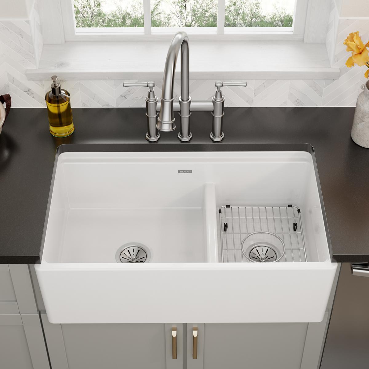 Stainless steel grid insert for right compartment of double-bowl farmhouse sink.