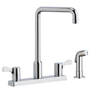 Chrome two-handle kitchen faucet with tall arc spout and separate side spray on white base plate.