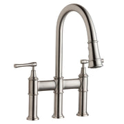 Lustrous steel bridge faucet with arched pull-down spout, two lever handles, and three-hole mounting configuration.