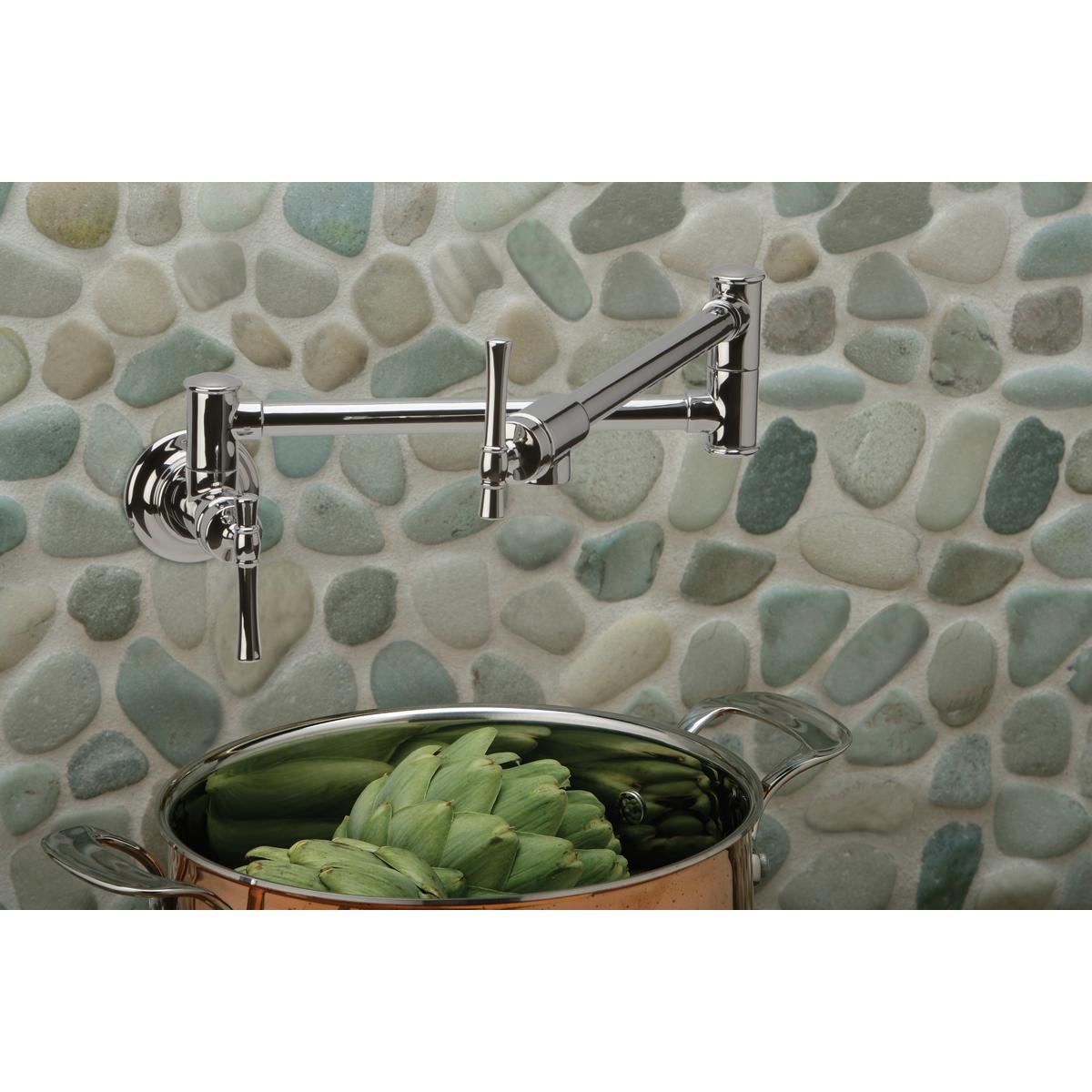 Chrome wall-mounted pot filler faucet with dual lever handles and articulating arm above a pot containing artichokes.