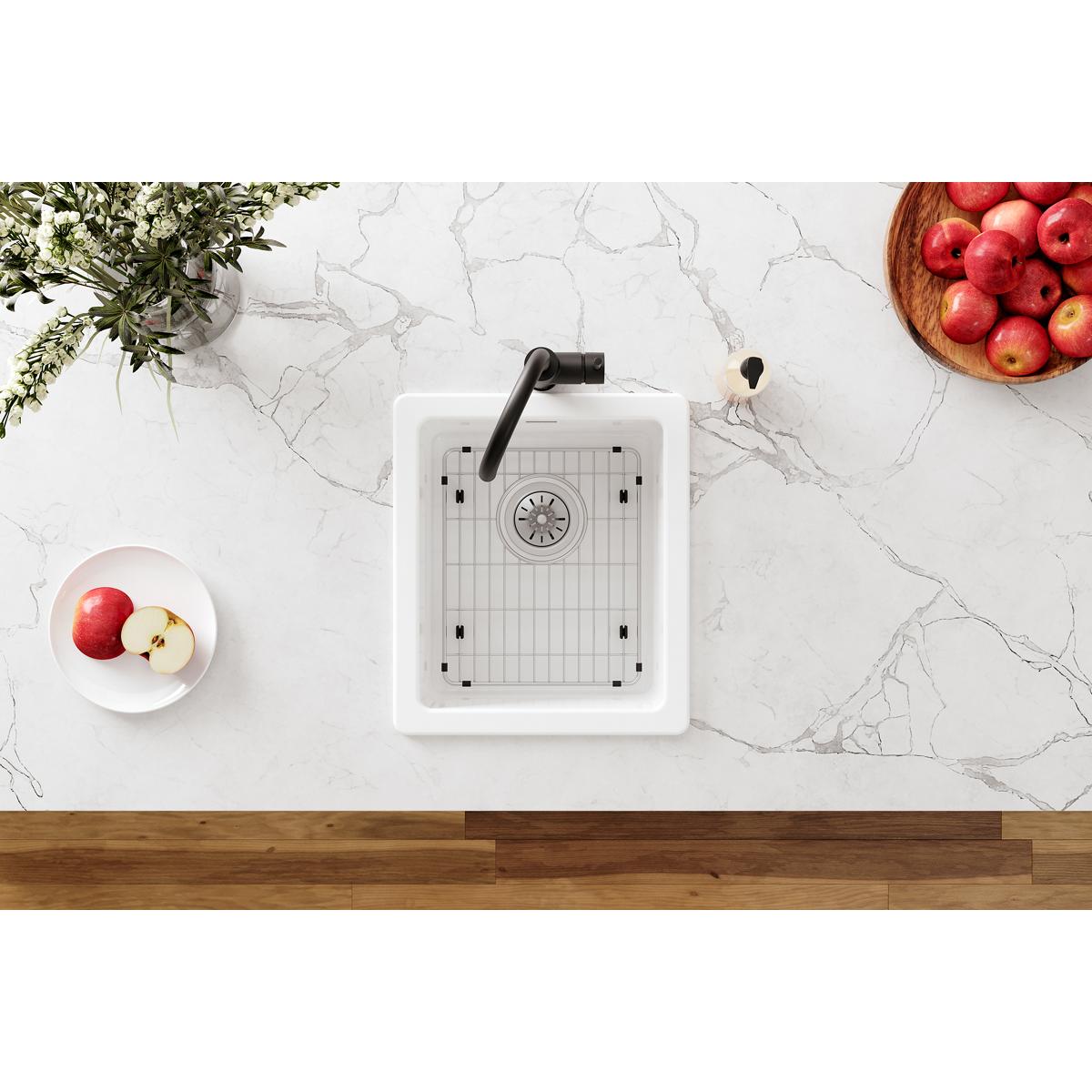 Stainless steel bottom grid with vertical bars for kitchen sink basin.