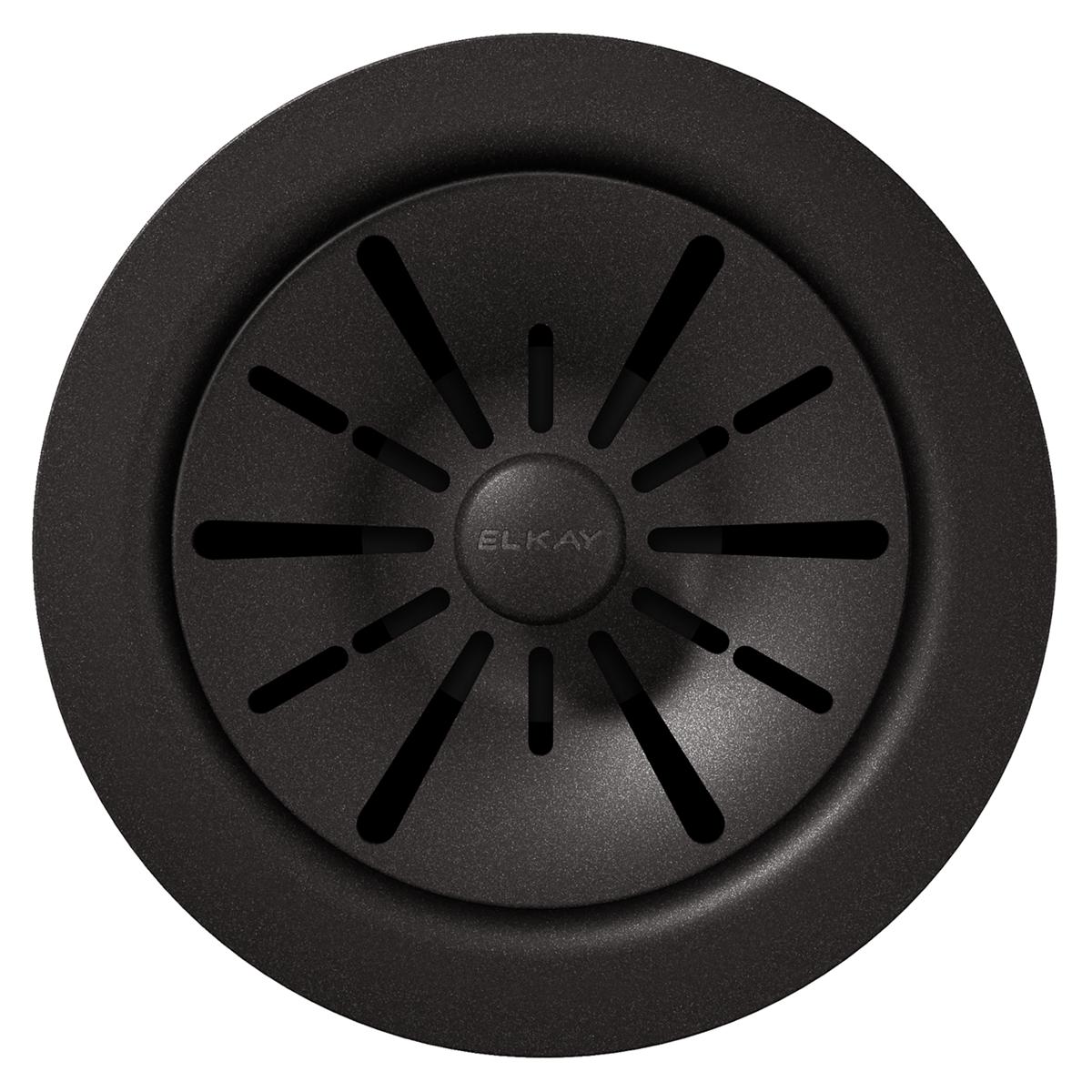 Black polymer sink drain flange with radial slot pattern and center circle marking.