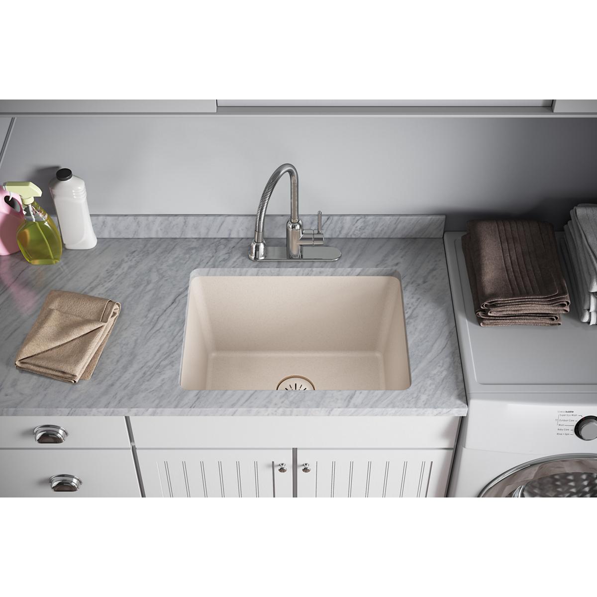 Cream-colored rectangular sink bowl with visible drain strainer opening in center.