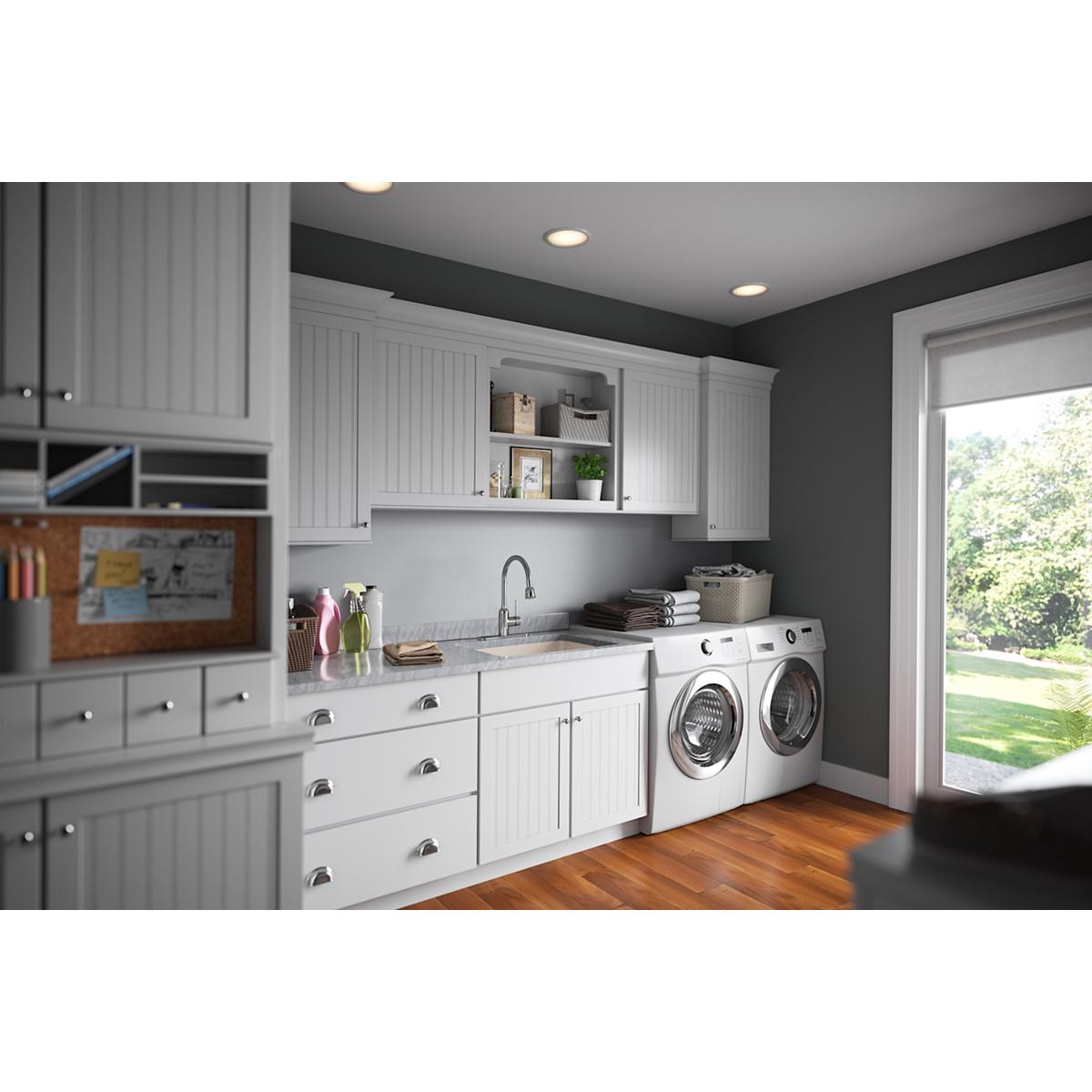 I can see this is a kitchen/laundry room interior image, but it does not show the actual product (basket strainer and rubber 