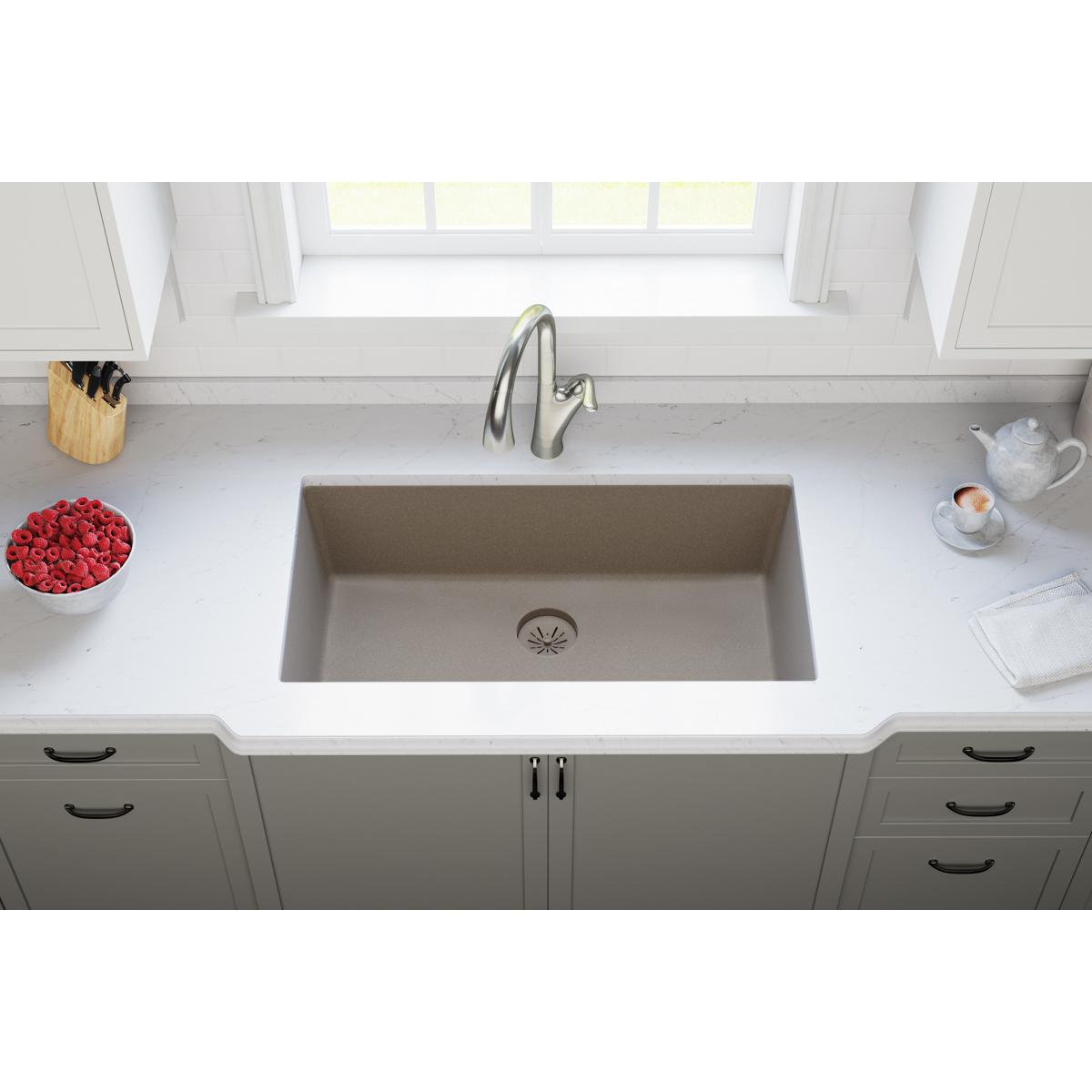 Silvermist quartz sink basin with starburst drain strainer visible at bottom center.