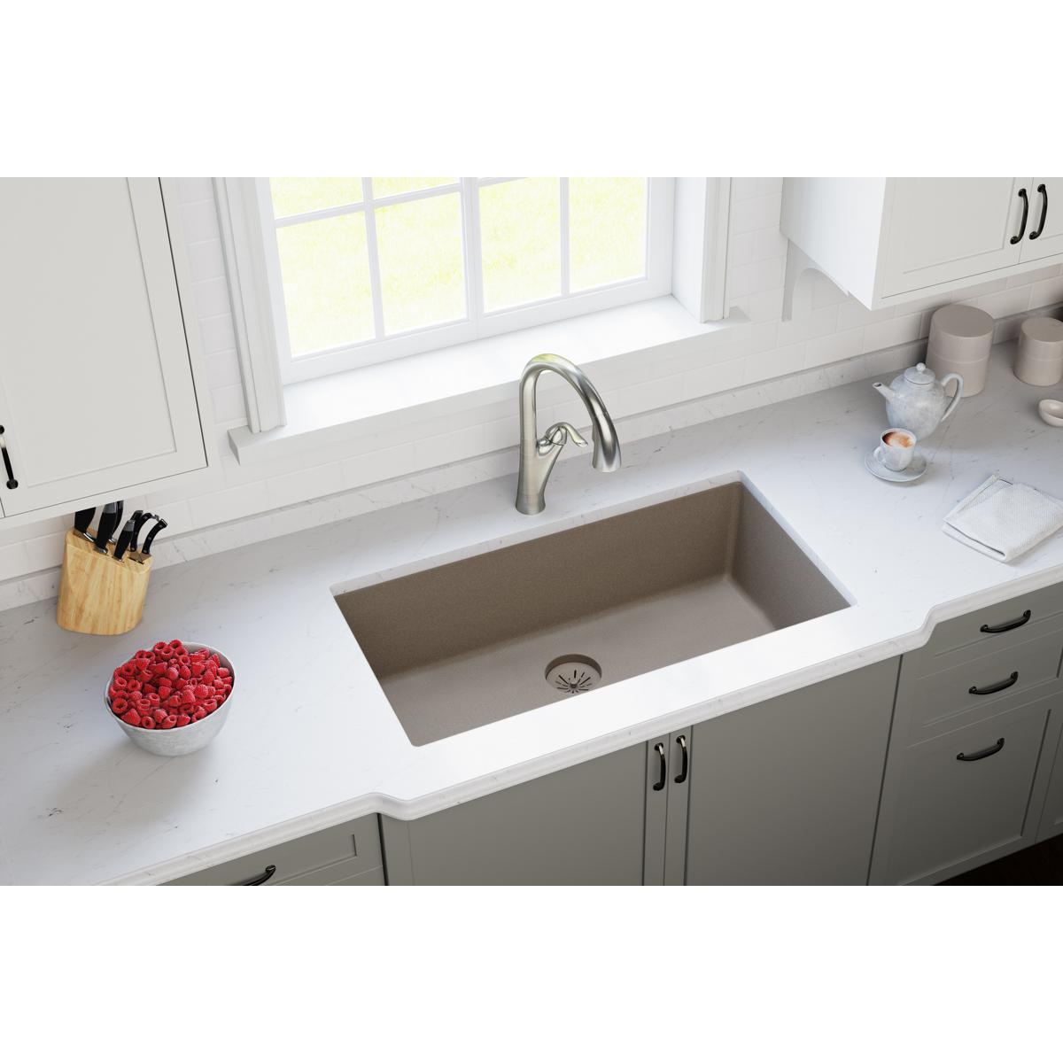 Silvermist drain strainer with removable polymer basket installed in undermount kitchen sink.