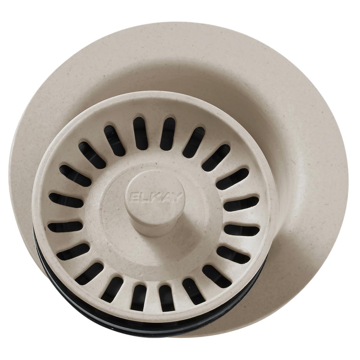 Beige polymer disposer flange with removable basket strainer featuring black drain slots and center knob.