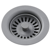 Greystone polymer drain fitting with removable basket strainer and central knob, viewed from above.