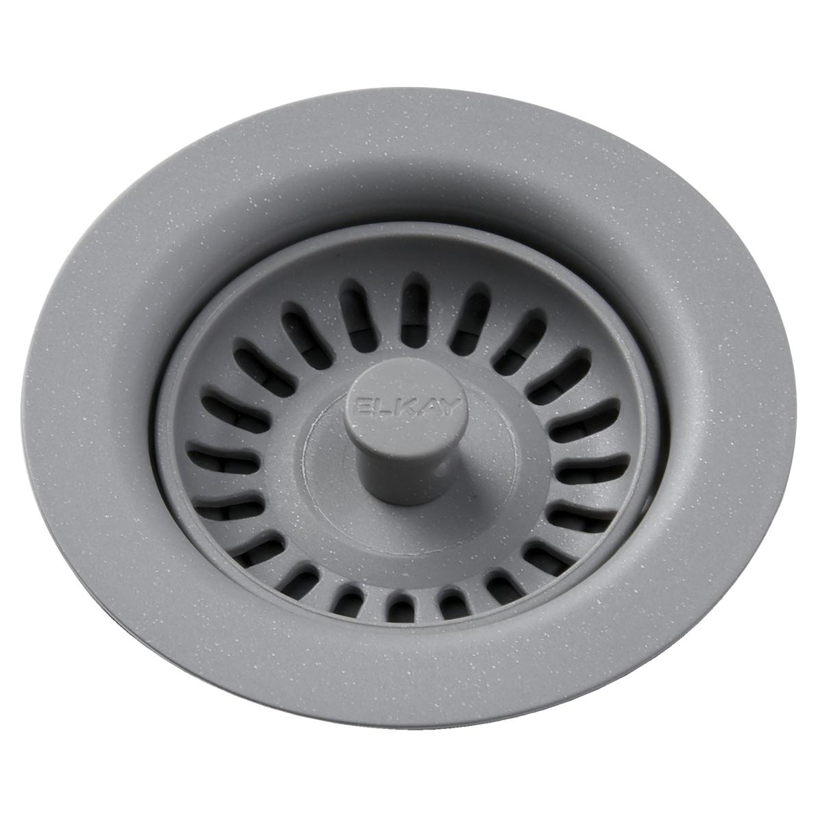 Greystone polymer drain fitting with removable basket strainer and central knob, viewed from above.