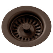 Mocha polymer drain fitting with removable basket strainer and center post, viewed from above.