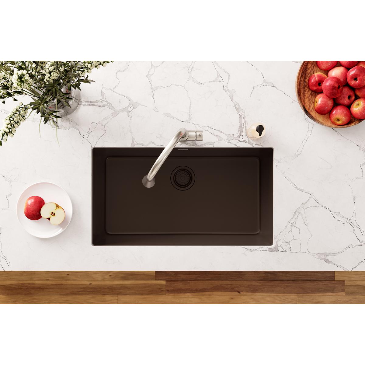 Mocha polymer sink with single faucet, removable basket strainer, and drain hole visible from above.