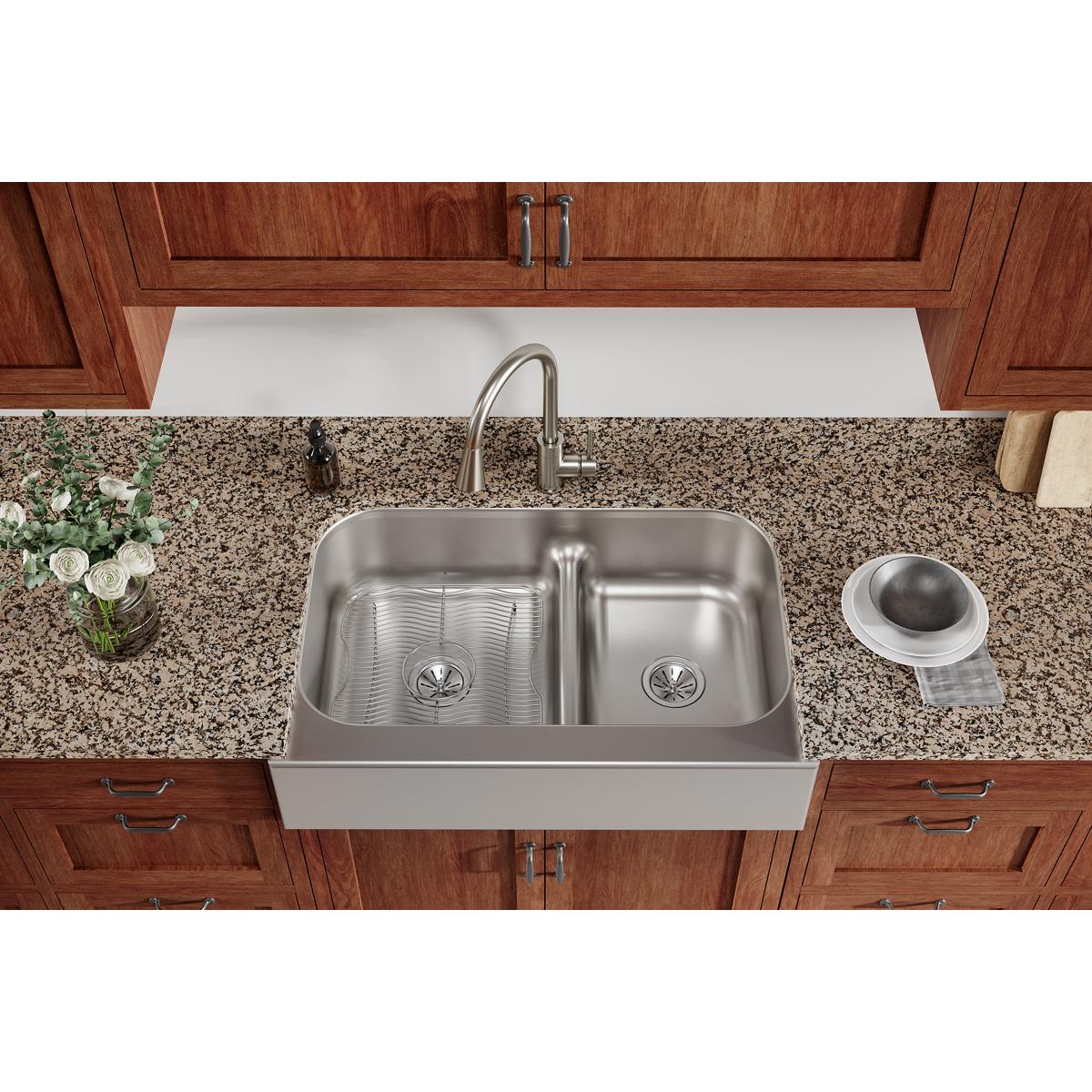 Stainless steel sink bottom grid with rectangular wire pattern for left basin compartment.