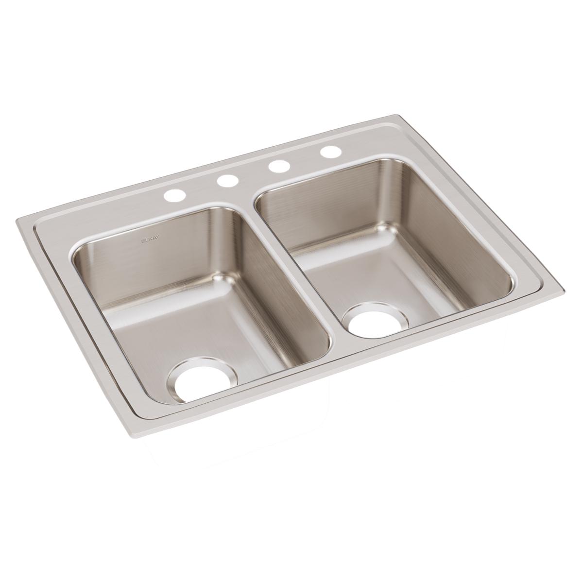 Stainless steel drop-in sink with two equal bowls and four faucet holes across the rim.