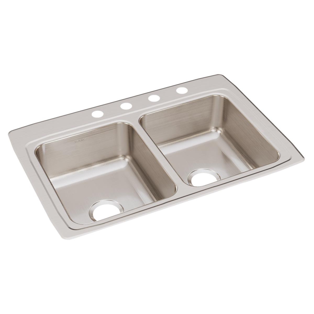 Stainless steel double bowl drop-in sink with four faucet holes and brushed finish surface.