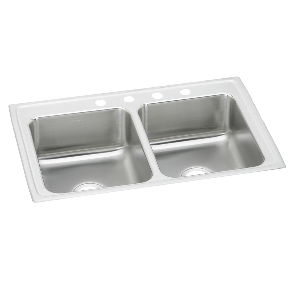 Stainless steel double bowl drop-in sink with white rim and four faucet holes along the top edge.
