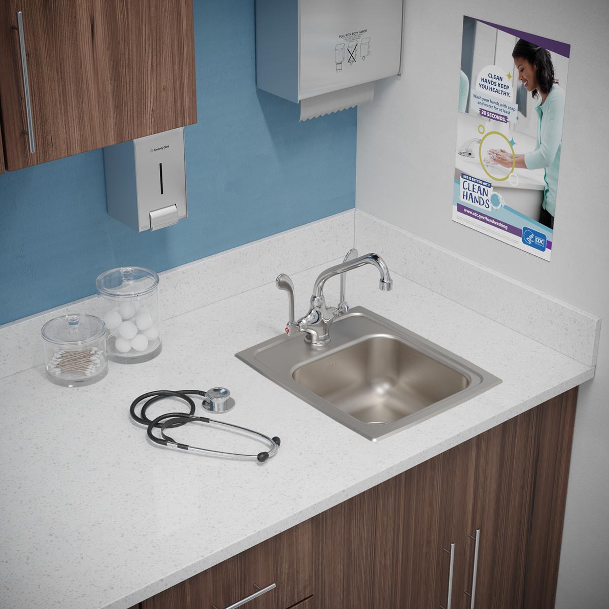 Stainless steel drop-in sink with single bowl and one faucet hole, installed in white countertop with chrome faucet.