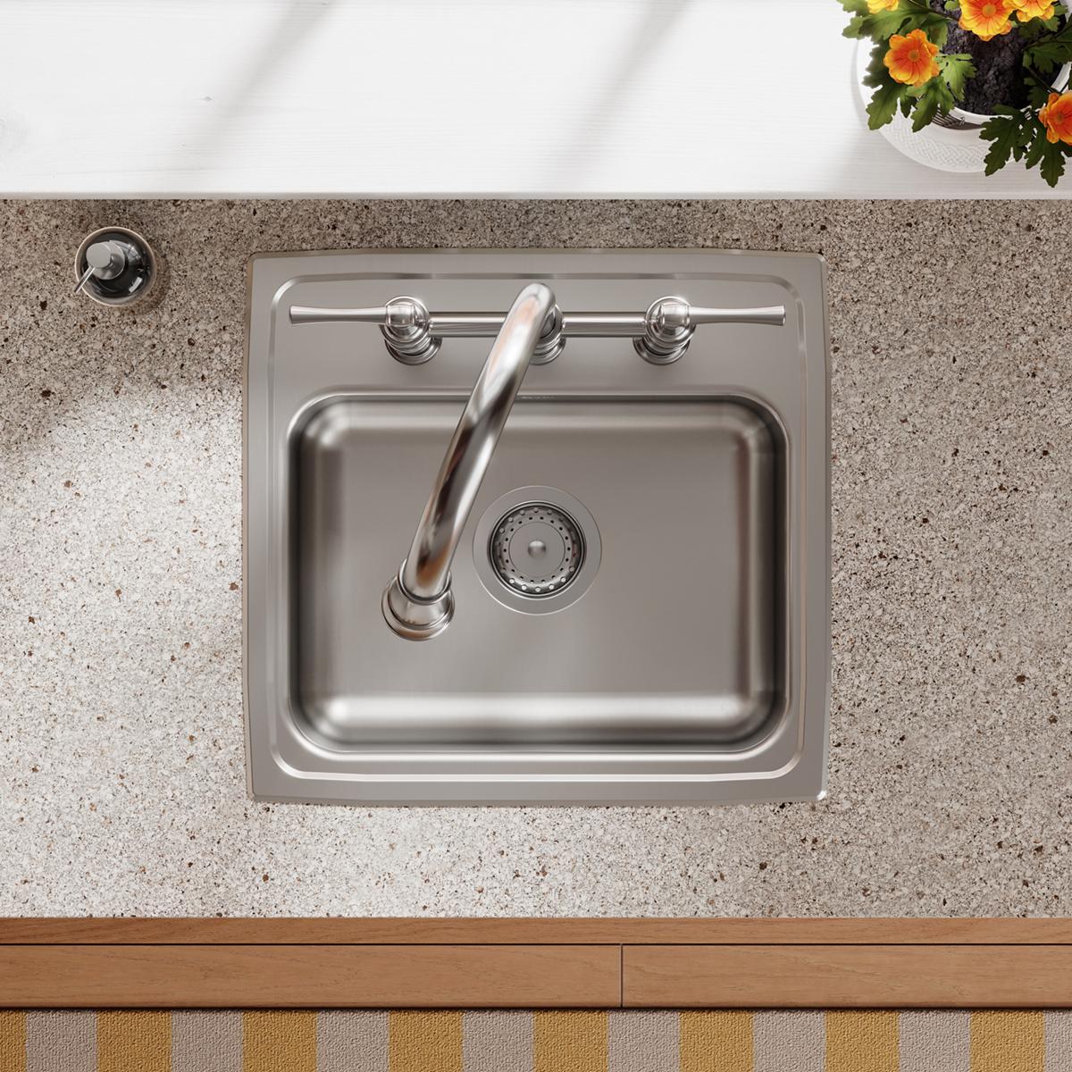 Stainless steel drop-in sink with single bowl, three faucet holes, and grab bar installed in countertop.