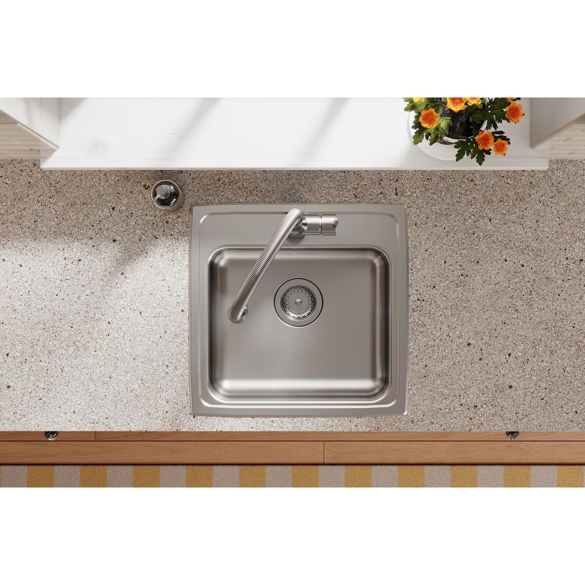 Stainless steel drop-in sink with single bowl and faucet installed in countertop, viewed from above.