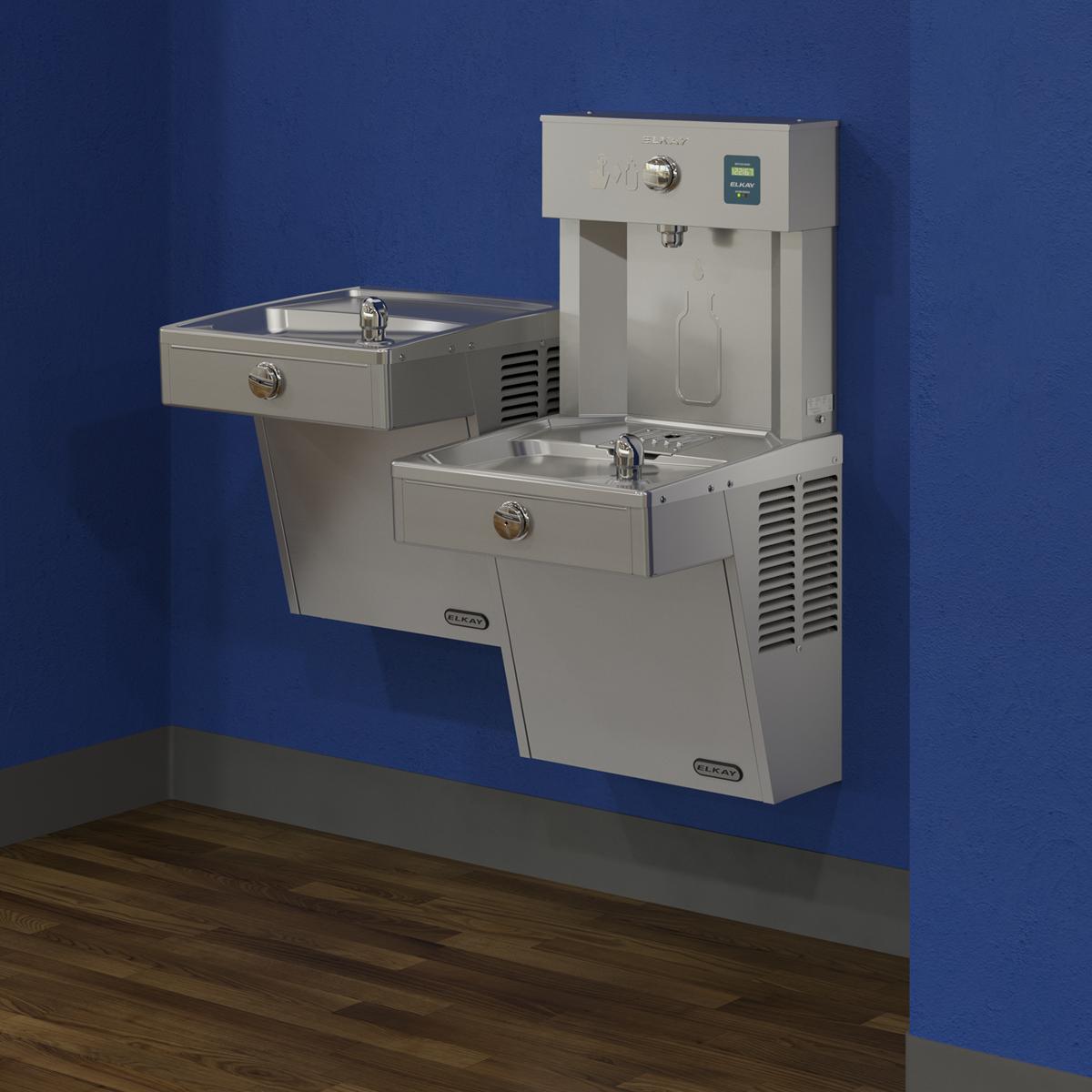 Stainless steel wall-mounted water cooler with two drinking fountains at different heights and bottle filling station above.