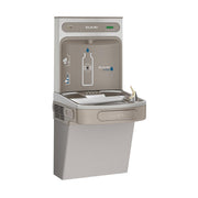 Light gray Elkay ezH2O bottle filling station with integrated cooler, front-mounted faucet, and digital control panel.