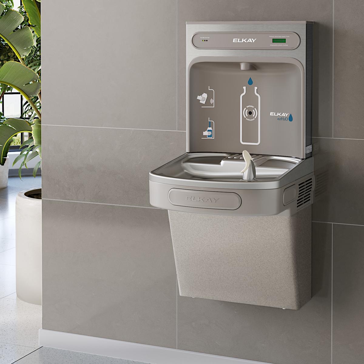 Light gray Elkay bottle filling station with refrigerated cooler compartment and water bottle dispenser mounted on wall.