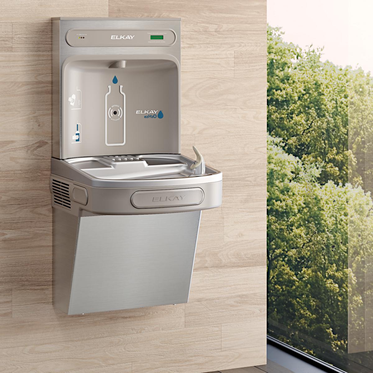 Stainless steel wall-mounted Elkay water bottle filling station with cooler compartment and filtered dispenser mounted on lig