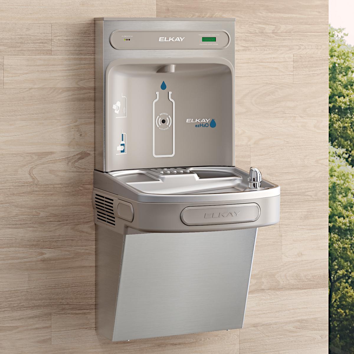 Stainless steel Elkay ezH2O bottle filling station mounted on wall with single drinking fountain basin below.