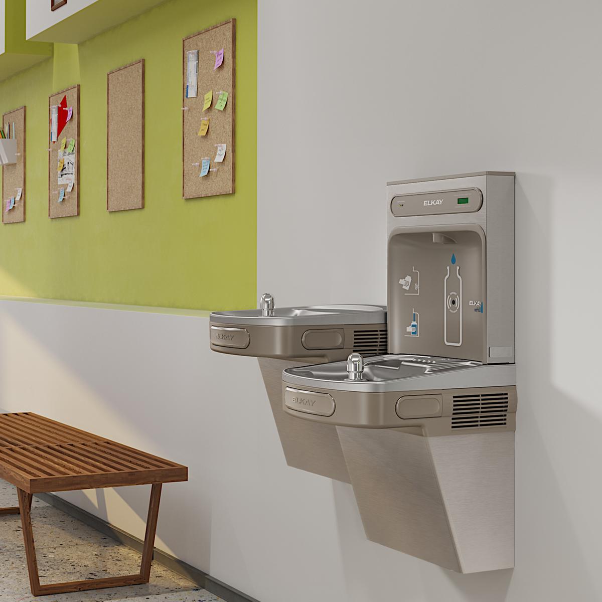 Elkay stainless steel bi-level water cooler and bottle filling station mounted on wall with two drinking fountains.