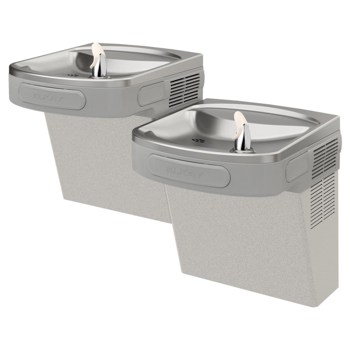 Stainless steel wall-mounted dual-level water cooler with filtered spouts at different heights and beige concrete base.