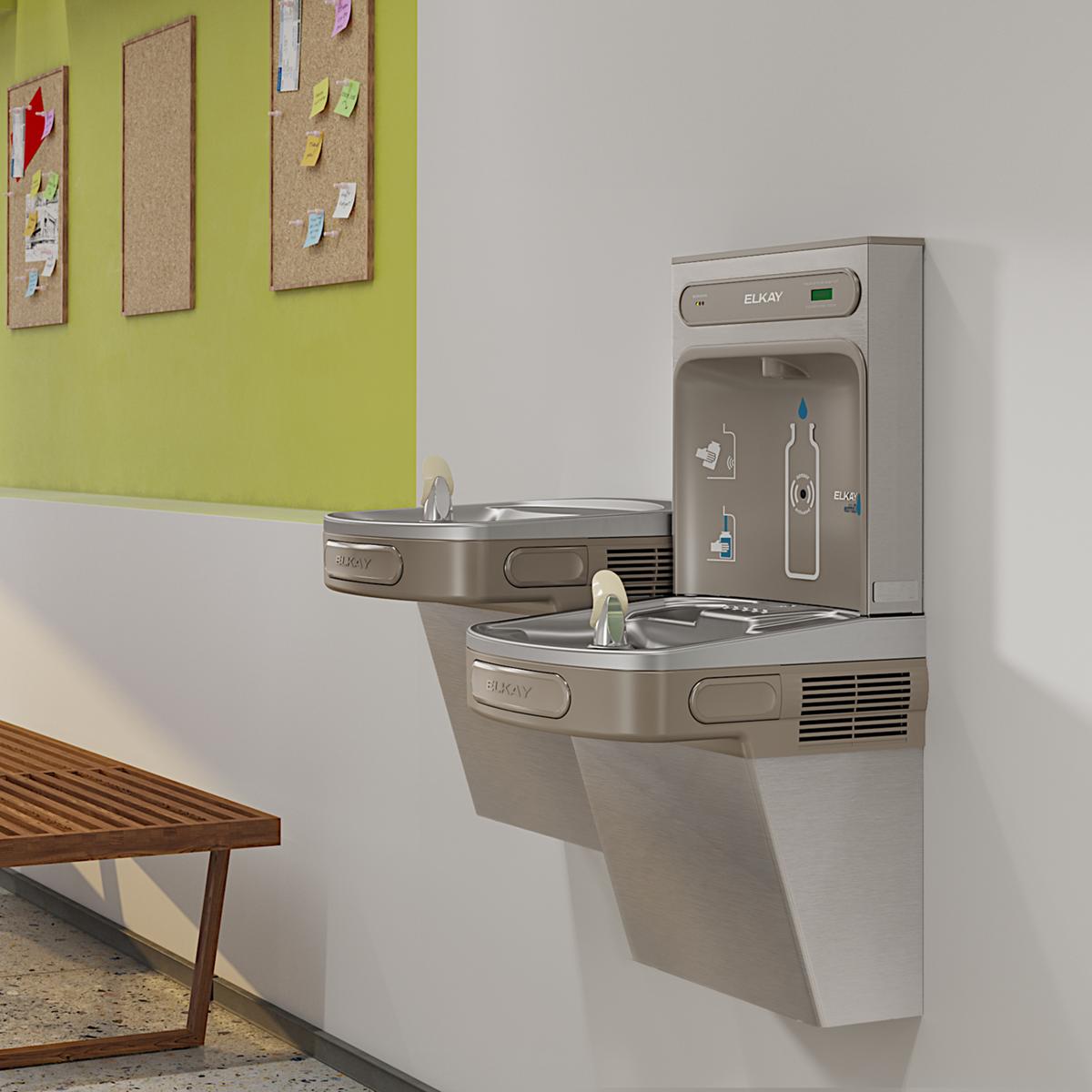 Stainless steel water cooler with dual-level filling stations mounted on wall, including upper bottle filler and lower drinki