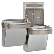 Elkay stainless steel water cooler with bi-level drinking fountains and bottle filling station mounted on wall behind.