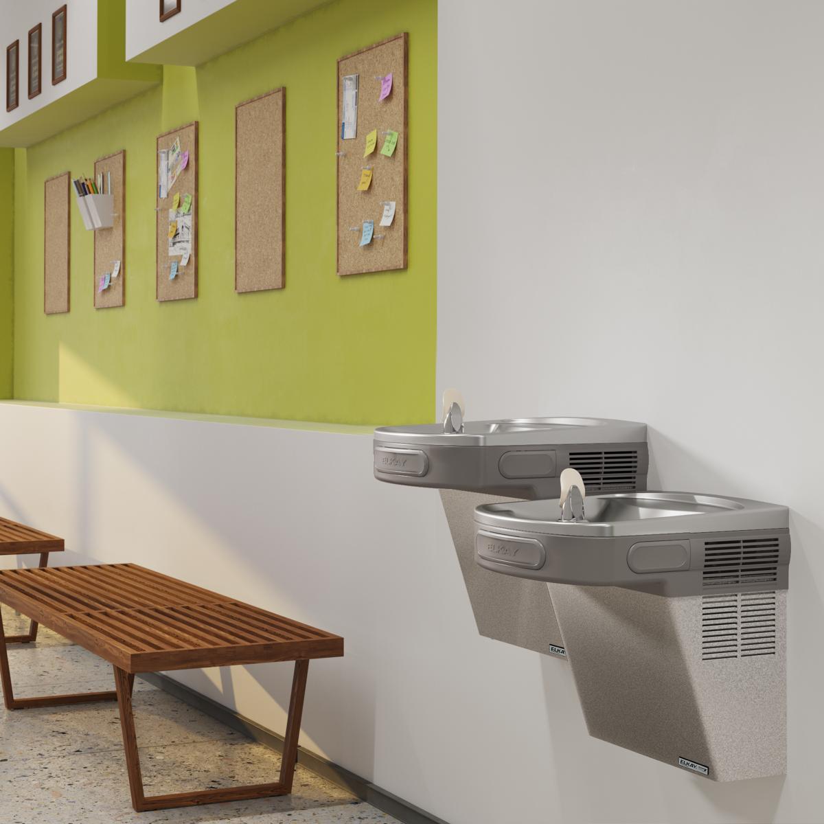 Wall-mounted bi-level water cooler with light gray granite finish and two drinking fountains at different heights.