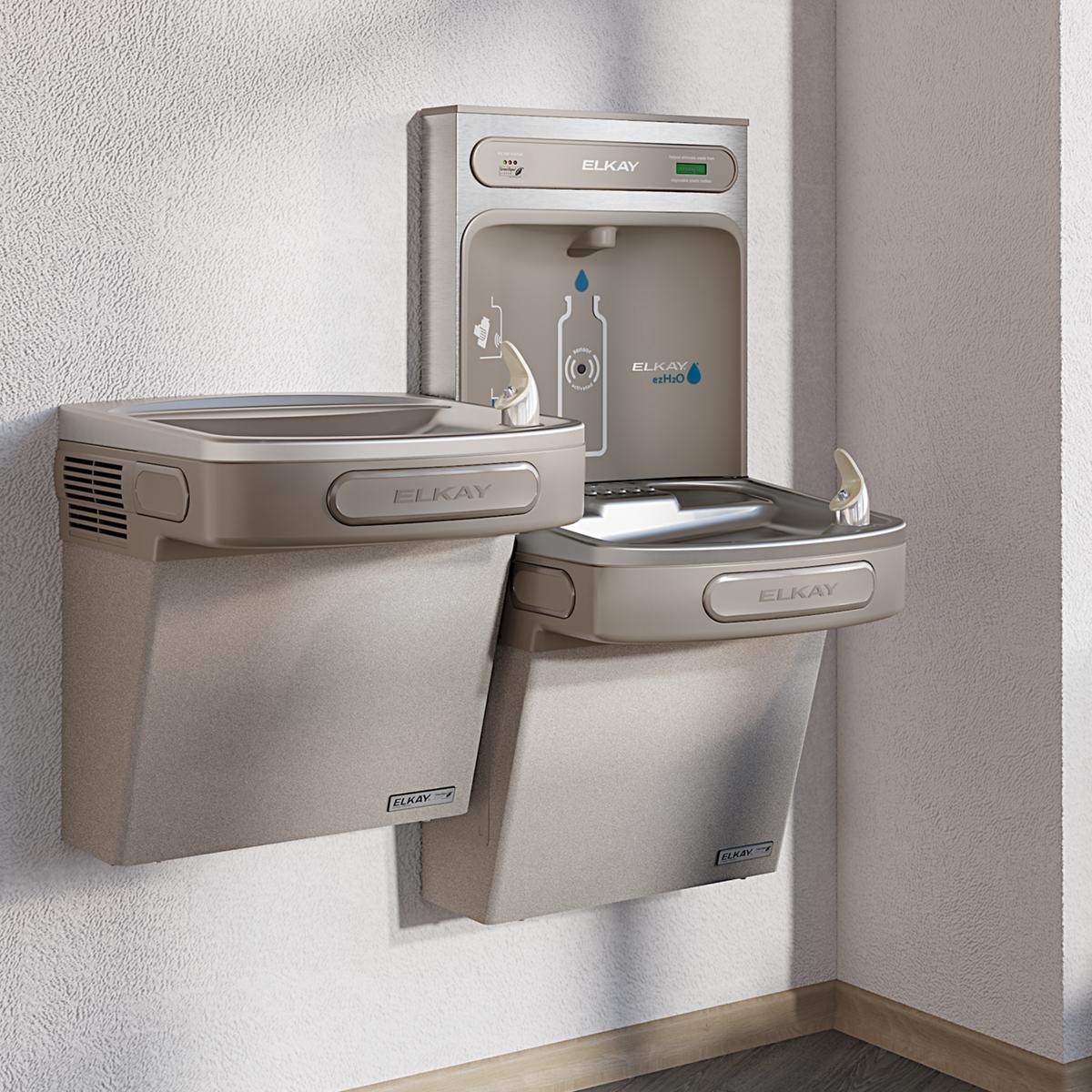Light gray Elkay water fountain with dual-level drinking stations and bottle filling spout mounted on wall.