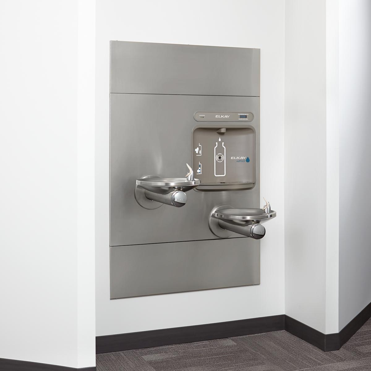 Stainless steel wall-mounted water fountain with dual bottle-filling stations and integrated drinking fountain at different h