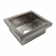 Polished nickel square sink with hammered interior texture and single drain opening.