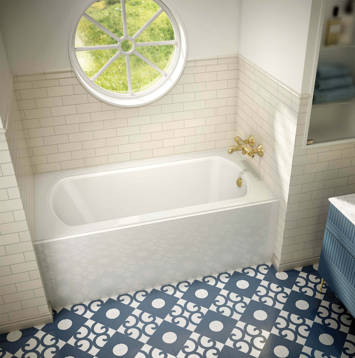 Biscuit-colored rectangular soaking bathtub installed in alcove with brass faucet and right-side drain.