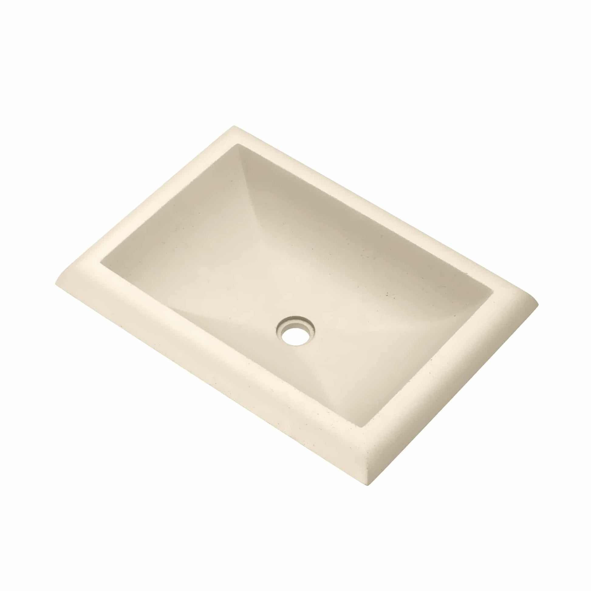 Rectangular undermount bathroom sink in sand-colored stone with single drain hole.